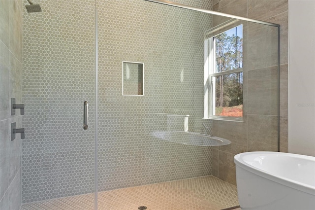 full bathroom featuring a shower stall