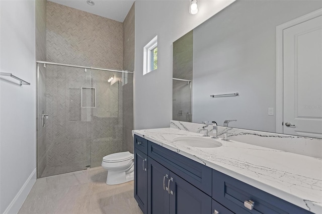 full bathroom featuring baseboards, toilet, a stall shower, and vanity