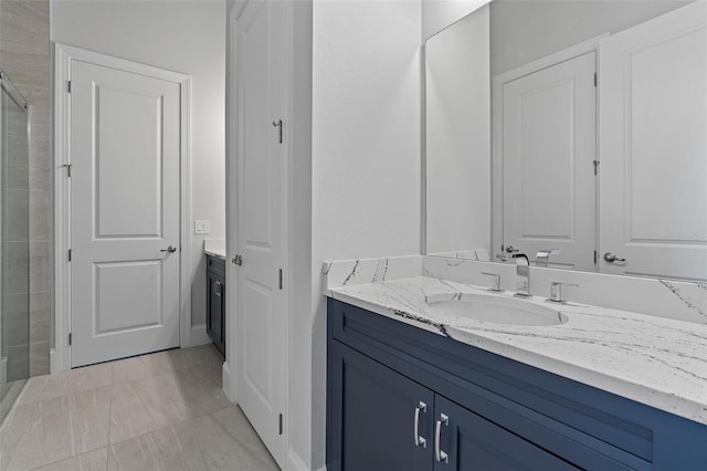 full bath featuring a shower stall and vanity