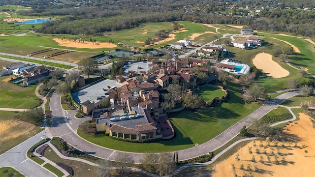 bird's eye view with view of golf course and a water view