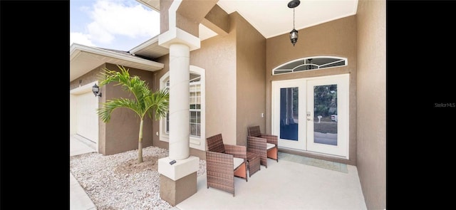 property entrance featuring french doors