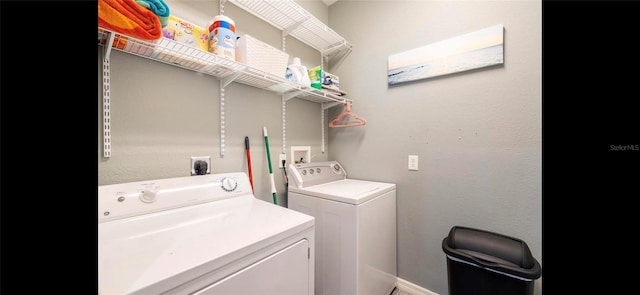 laundry area featuring washing machine and clothes dryer