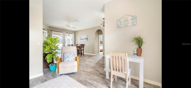 interior space featuring ceiling fan and light wood-type flooring