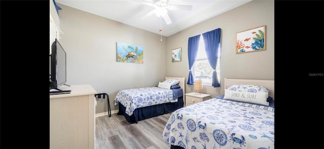 bedroom featuring ceiling fan and light hardwood / wood-style flooring