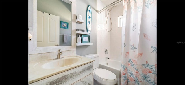 full bathroom with vanity, shower / bath combination with curtain, and toilet