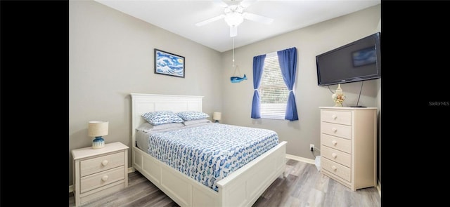 bedroom with ceiling fan and light hardwood / wood-style flooring