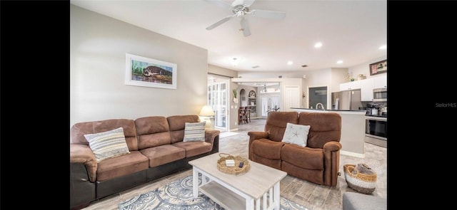 living room featuring ceiling fan