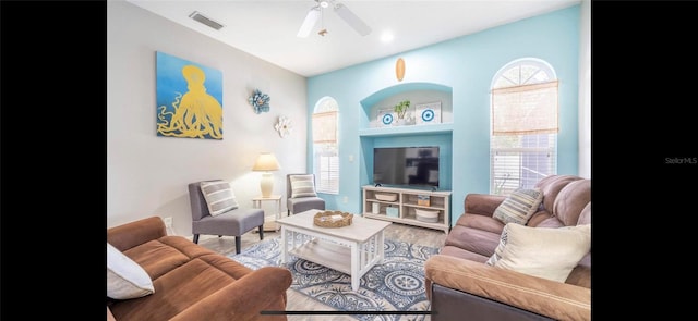 living room with hardwood / wood-style flooring and ceiling fan