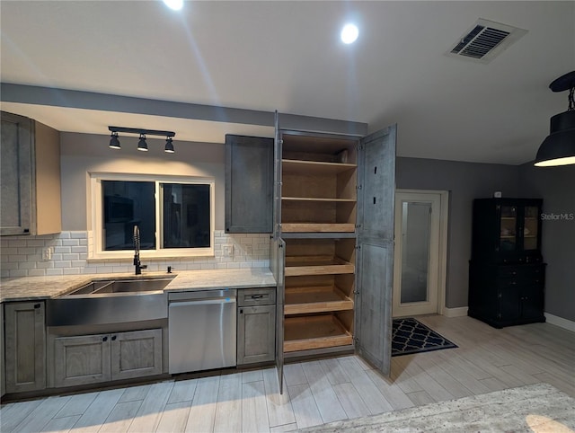 kitchen featuring gray cabinets, visible vents, light countertops, and dishwasher