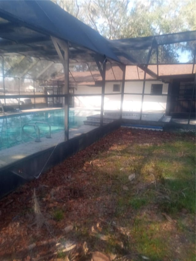 view of pool featuring a lanai