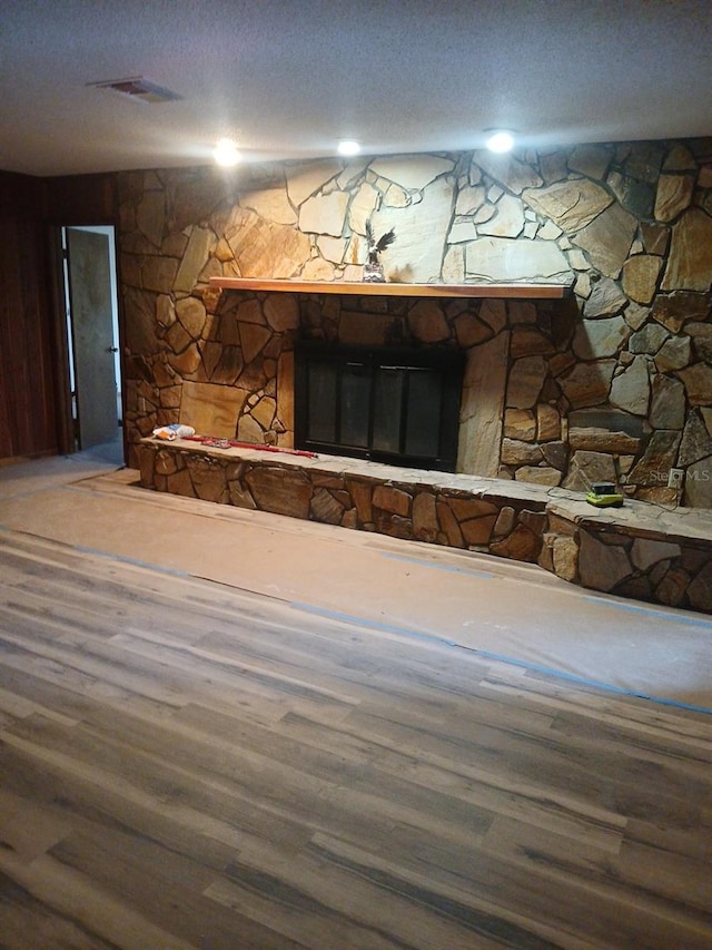 interior details with wood-type flooring and a textured ceiling