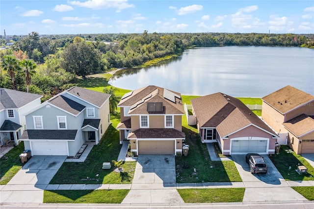 birds eye view of property with a water view