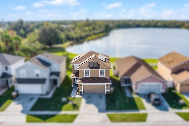 bird's eye view featuring a water view and a residential view