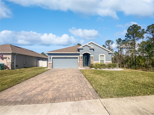 view of front of property featuring a garage and a front yard