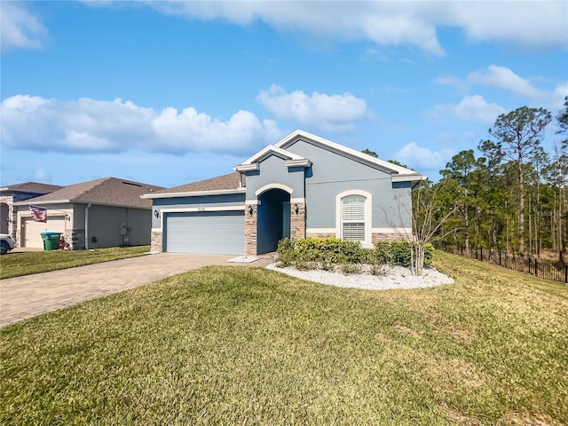 view of front facade featuring a garage and a front yard