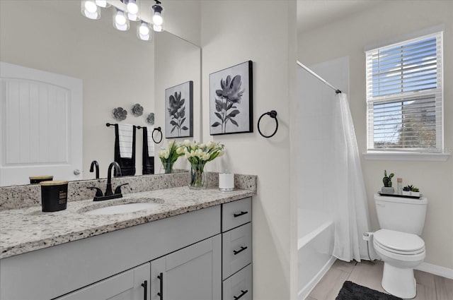 full bathroom with shower / bathtub combination with curtain, vanity, and toilet