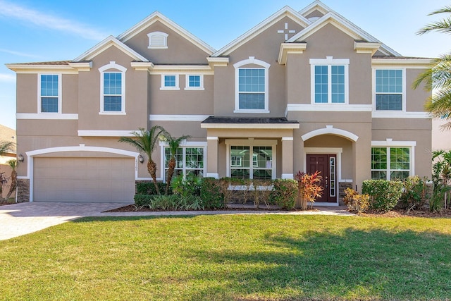 view of front of house featuring a garage and a front lawn