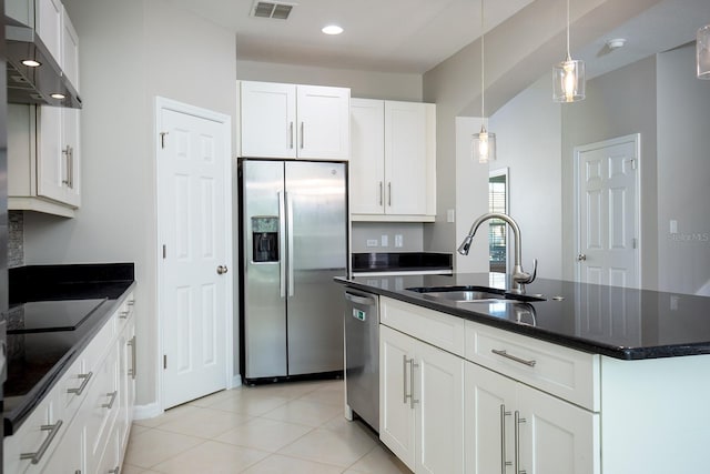 15165 Heron Hideaway Cir, Winter Garden, FL 34787 - kitchen featuring appliances with stainless steel finishes, sink, white cabinets, a center island with sink, and wall chimney exhaust hood