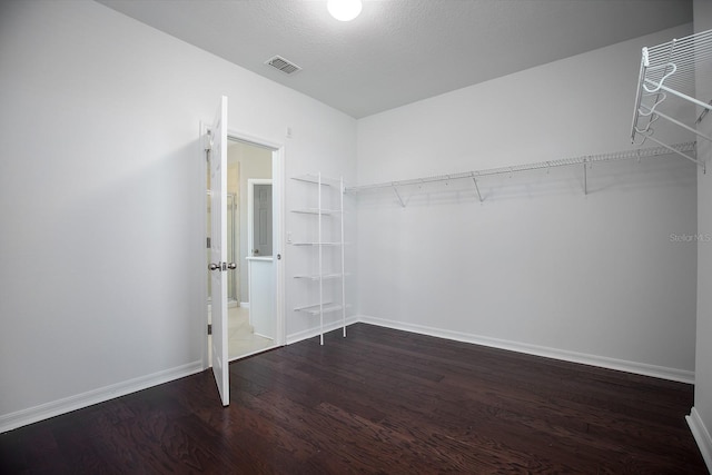 15165 Heron Hideaway Cir, Winter Garden, FL 34787 - walk in closet with dark hardwood / wood-style floors