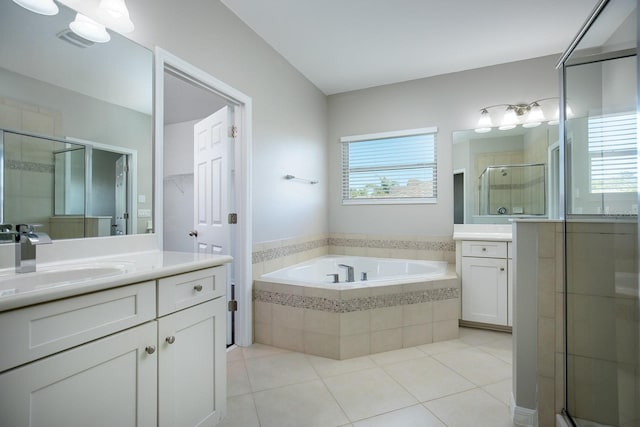 15165 Heron Hideaway Cir, Winter Garden, FL 34787 - bathroom with vanity, separate shower and tub, and tile patterned floors