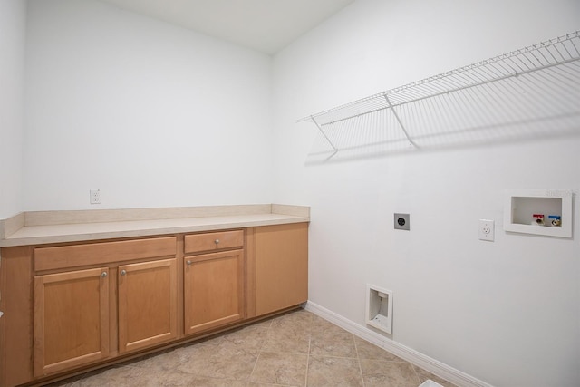 15165 Heron Hideaway Cir, Winter Garden, FL 34787 - laundry area featuring hookup for a washing machine, hookup for an electric dryer, cabinets, and light tile patterned floors