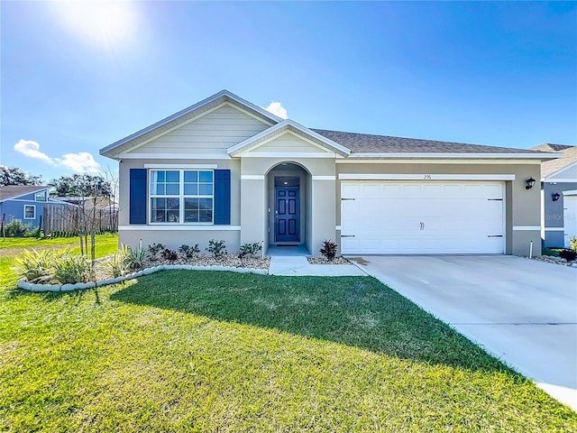 single story home with a garage and a front lawn