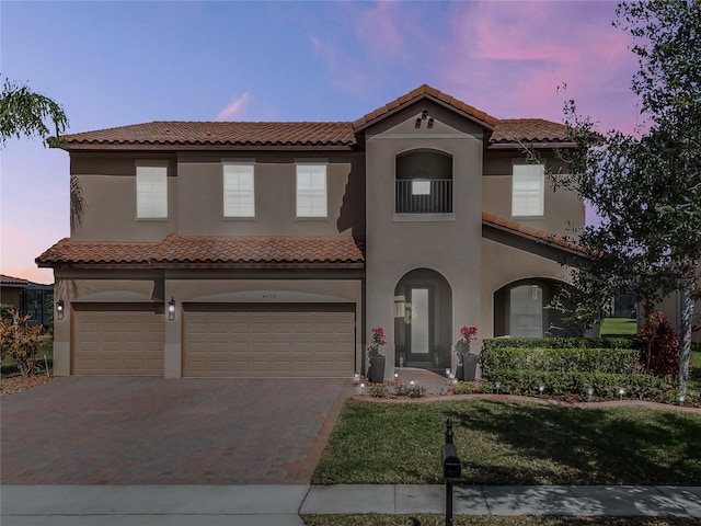 mediterranean / spanish house featuring a garage