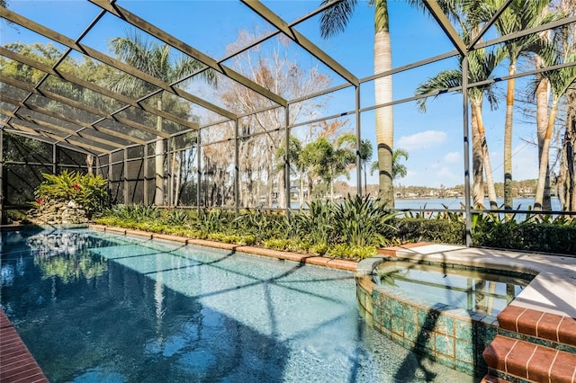 view of pool with an in ground hot tub and a lanai