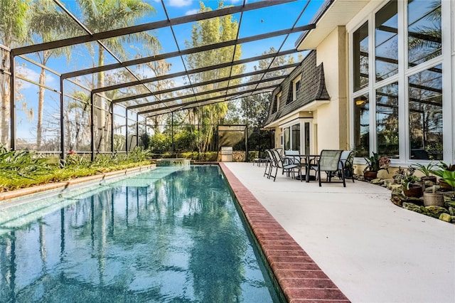 view of swimming pool with a patio and glass enclosure