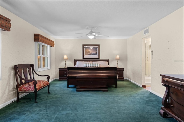 sitting room featuring dark colored carpet and ceiling fan