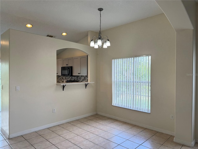 13900 Corrine Key Pl, Orlando, FL 32824 - unfurnished dining area with light tile patterned floors, a chandelier, recessed lighting, baseboards, and arched walkways