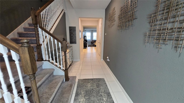 corridor featuring light tile patterned floors