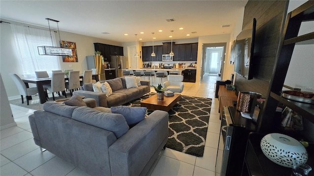 living room featuring light tile patterned flooring