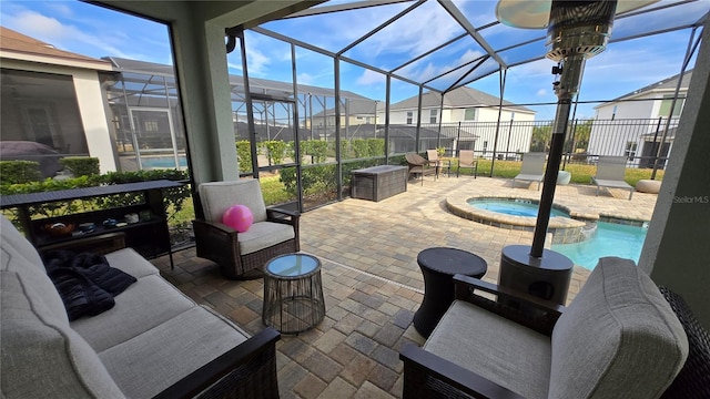 view of patio / terrace with a swimming pool with hot tub, an outdoor living space, and a lanai