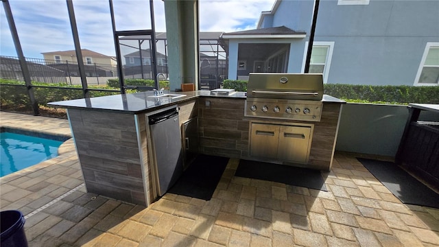 view of patio / terrace with area for grilling, an outdoor wet bar, and exterior kitchen