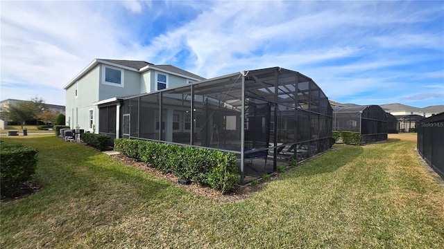 view of side of property with a lawn