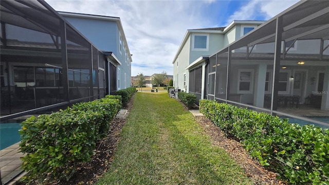 view of yard featuring a lanai