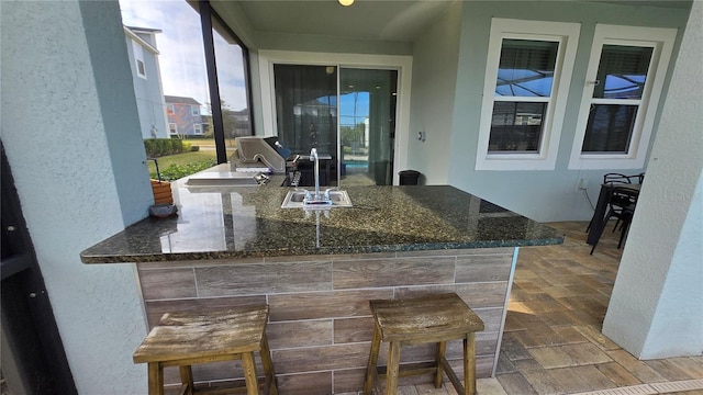 view of patio / terrace with an outdoor wet bar