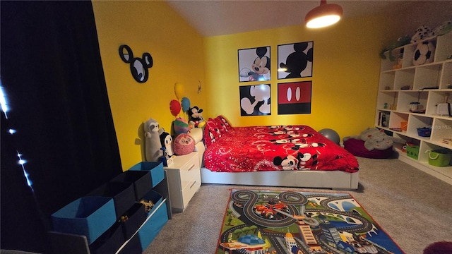 bedroom featuring vaulted ceiling and carpet