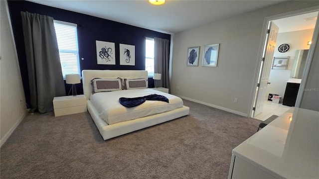 bedroom featuring light carpet