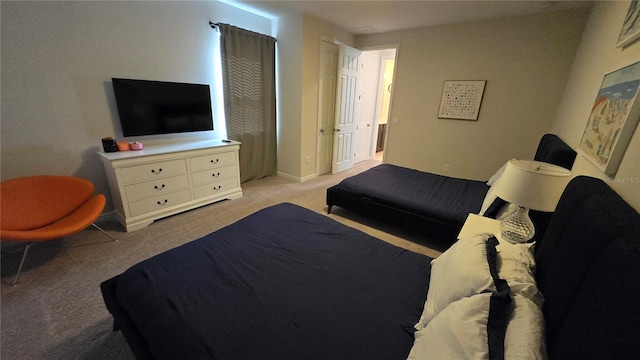 bedroom with light colored carpet