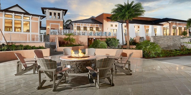 patio terrace at dusk with a fire pit