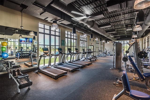 gym with a towering ceiling