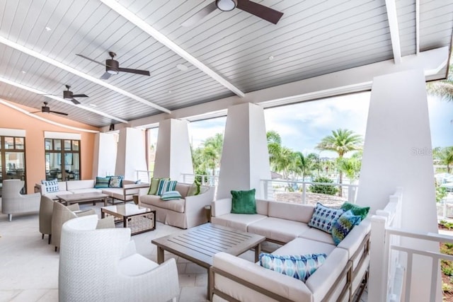 exterior space with ceiling fan and lofted ceiling with beams