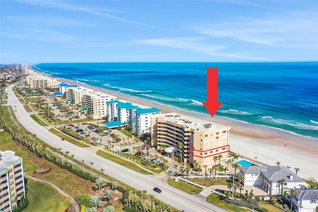 aerial view featuring a water view and a view of the beach