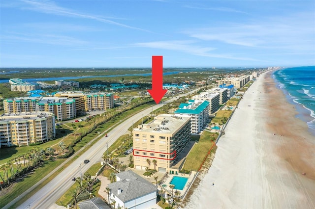 bird's eye view featuring a beach view and a water view