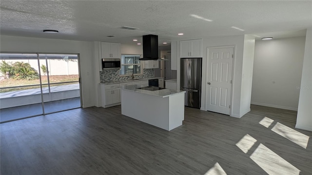 kitchen with a kitchen island, island range hood, refrigerator, sink, and white cabinets