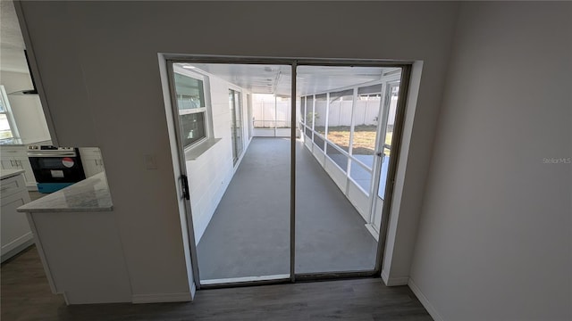 corridor featuring dark wood-type flooring