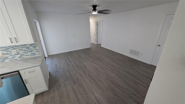 unfurnished living room with dark wood-type flooring and ceiling fan