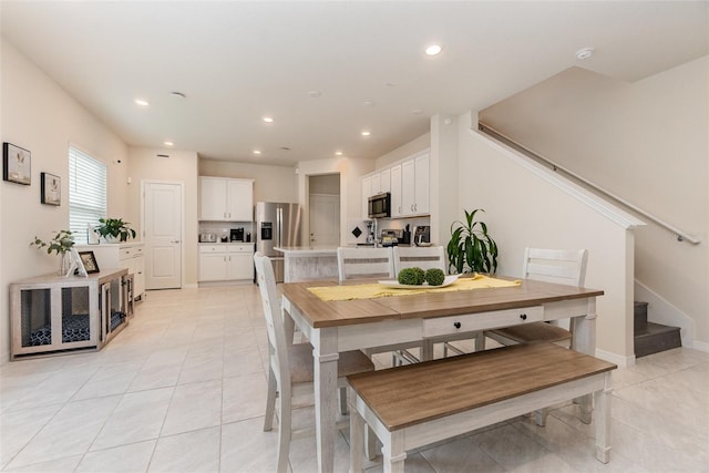 2623 Buena View Rd, Kissimmee, FL 34746 - dining room featuring light tile patterned flooring, stairway, recessed lighting, and baseboards